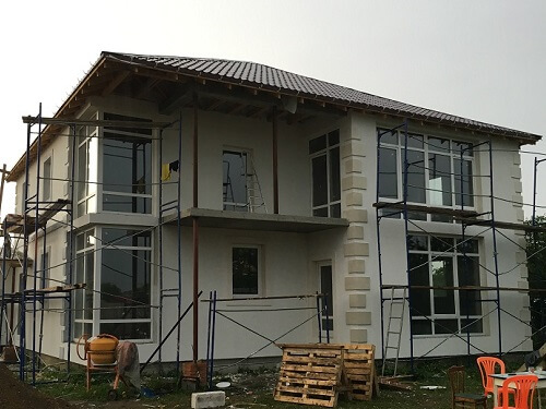 Отделка фасада дома штукатуркой в Ивенце